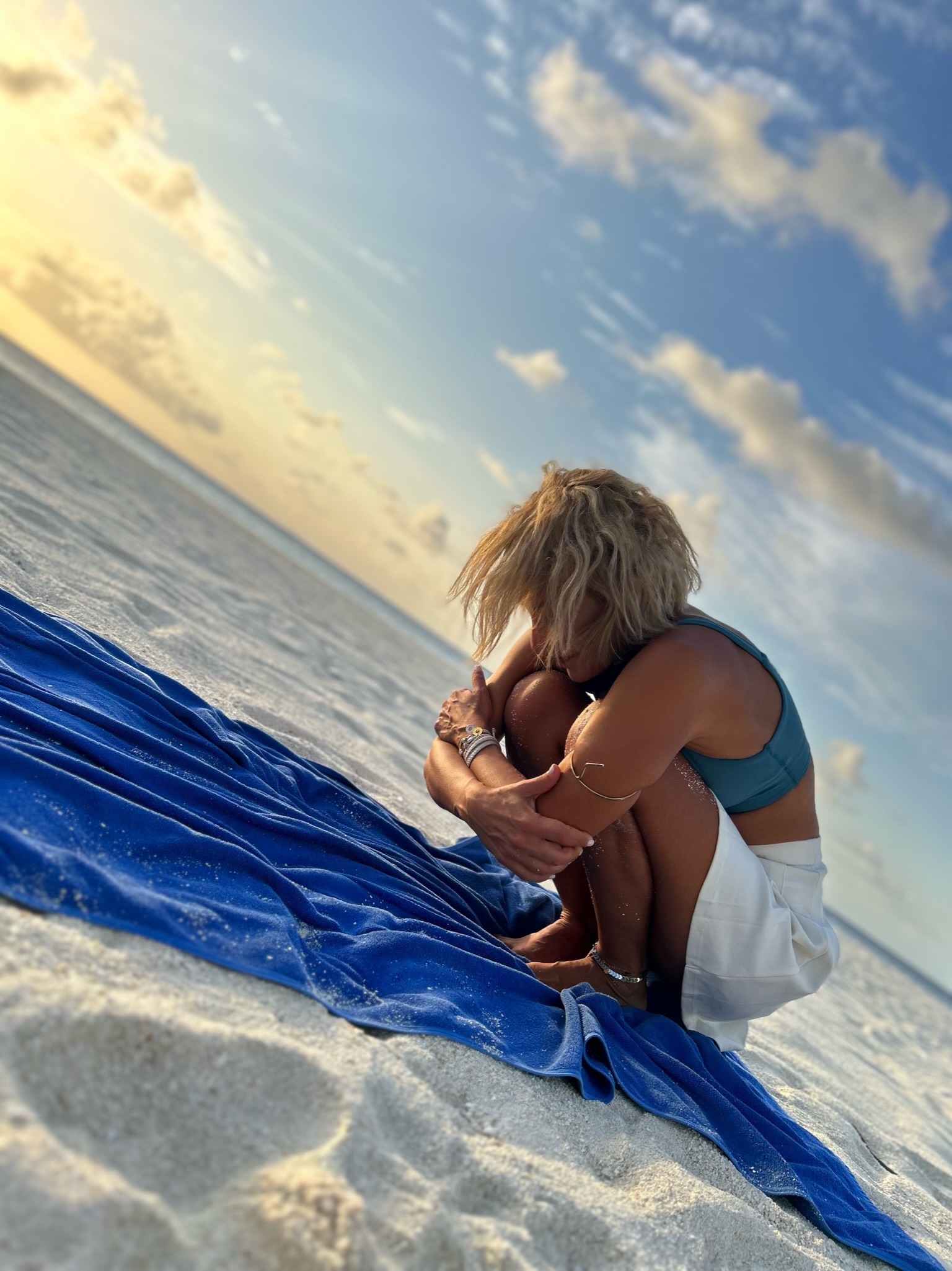 Intimate yoga moment on beach